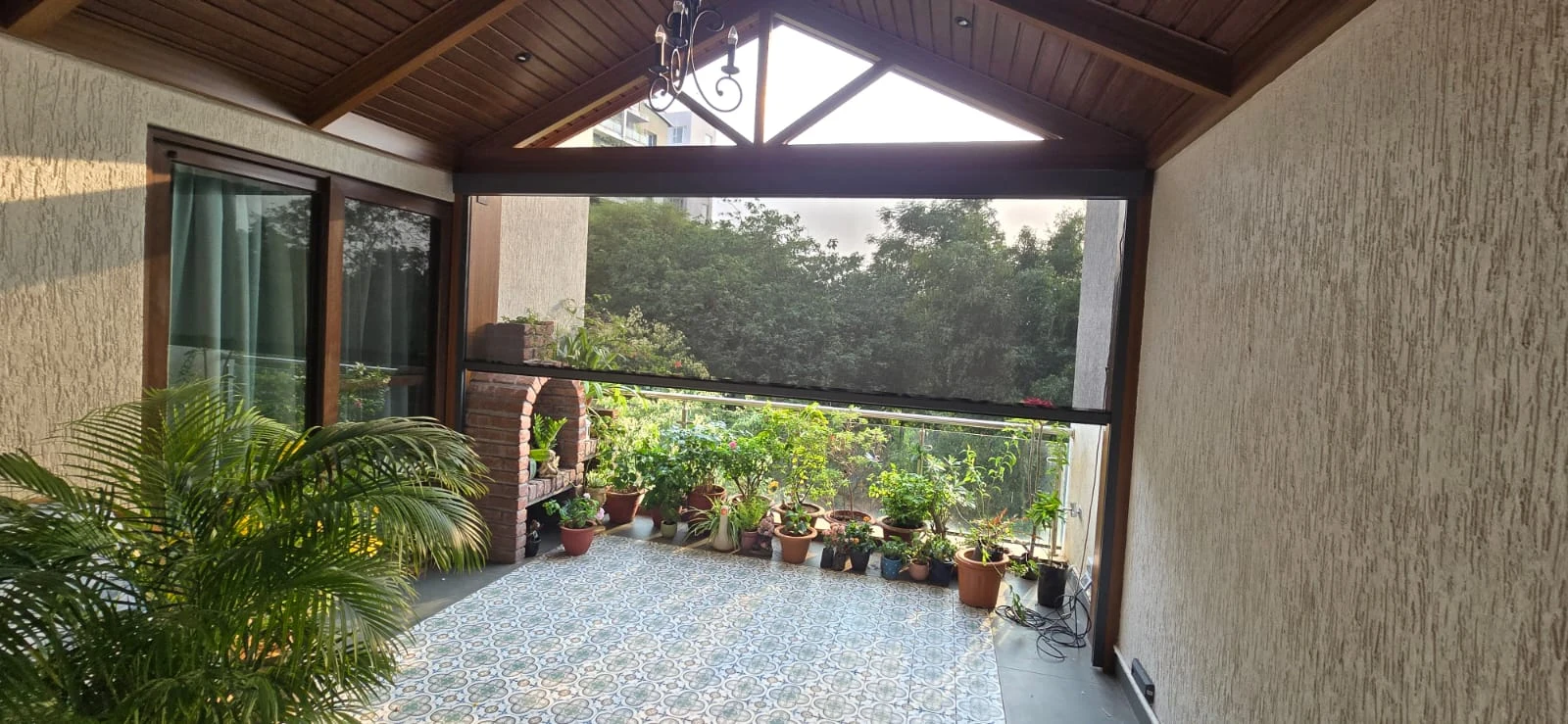 A screened terrace with greenery and natural light